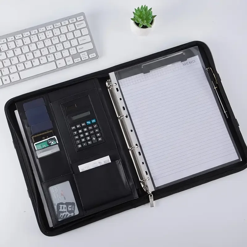 Black A4 PU document folder open to show pockets, a card slot and a built-in calculator