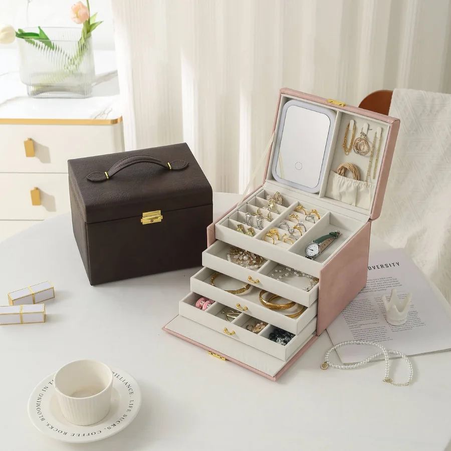 Four-layer lockable jewelry storage case with the drawers open, showing the velvet trays and the pieces in place