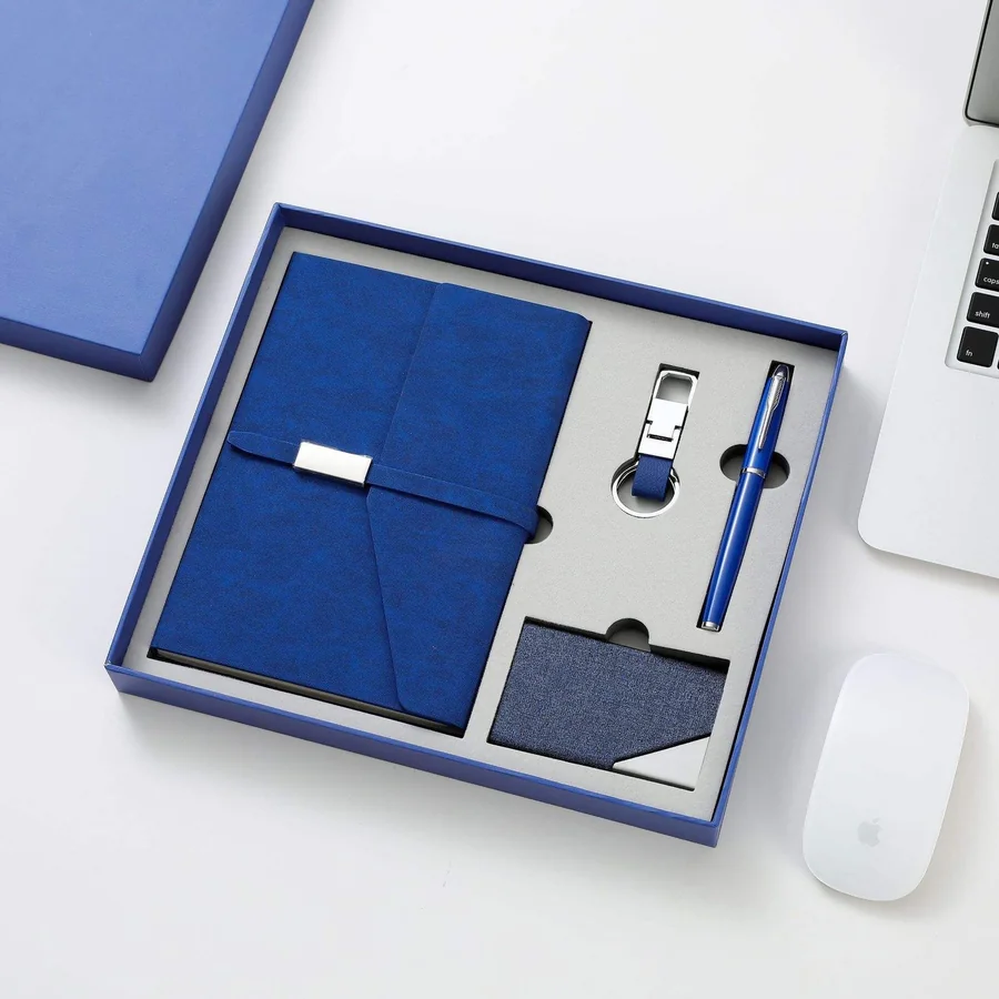 Blue gift box holding a PU leather card holder and a matching keychain, with a pen