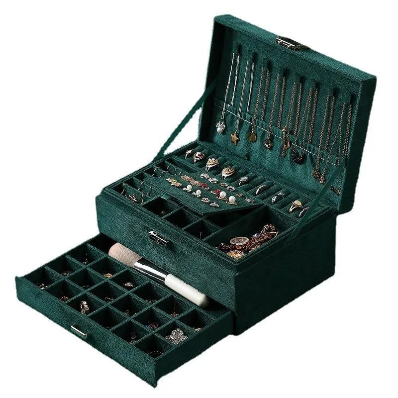Open three-layer jewelry storage box with a ring tray on top and a deeper compartment below